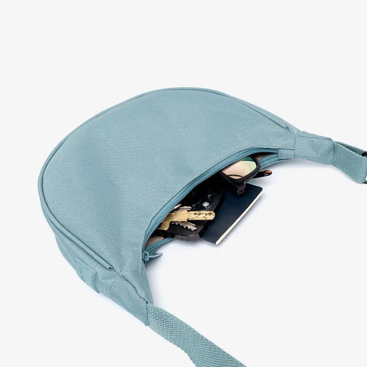 Lua Bag Stone Blue compact half-moon crossbody bag with zipper and strap Lefrik USA on Tampa Home & Garden Store