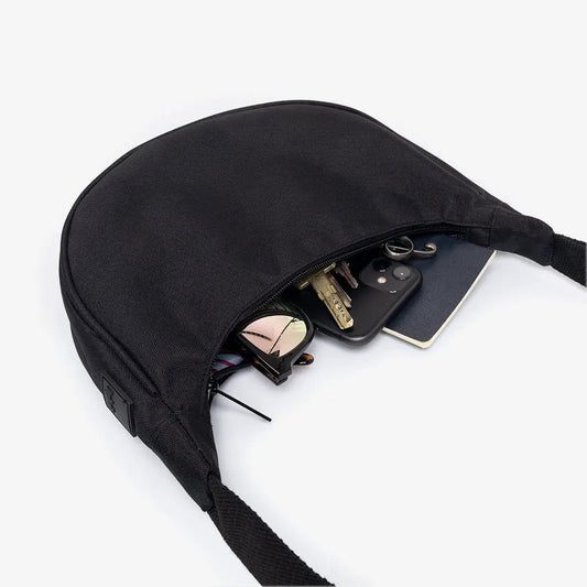 Lua Bag Half Moon Crossbody in black, crescent-shaped bag with zipper on Tampa Home & Garden Store