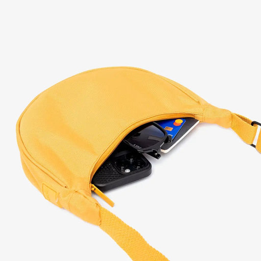 Lefrik Lua Bag mustard color compact half-moon handbag with phone, cards, and sunglasses on Tampa Home & Garden Store