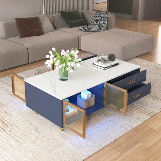 Modern navy blue coffee table with white marble top, glass-front storage, and gold metal frame on Tampa Home & Garden Store