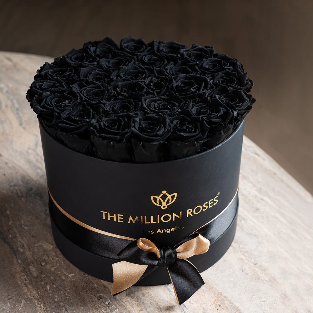 Supreme Black Box with black roses in a round hatbox by The Million Roses on Tampa Home & Garden Store