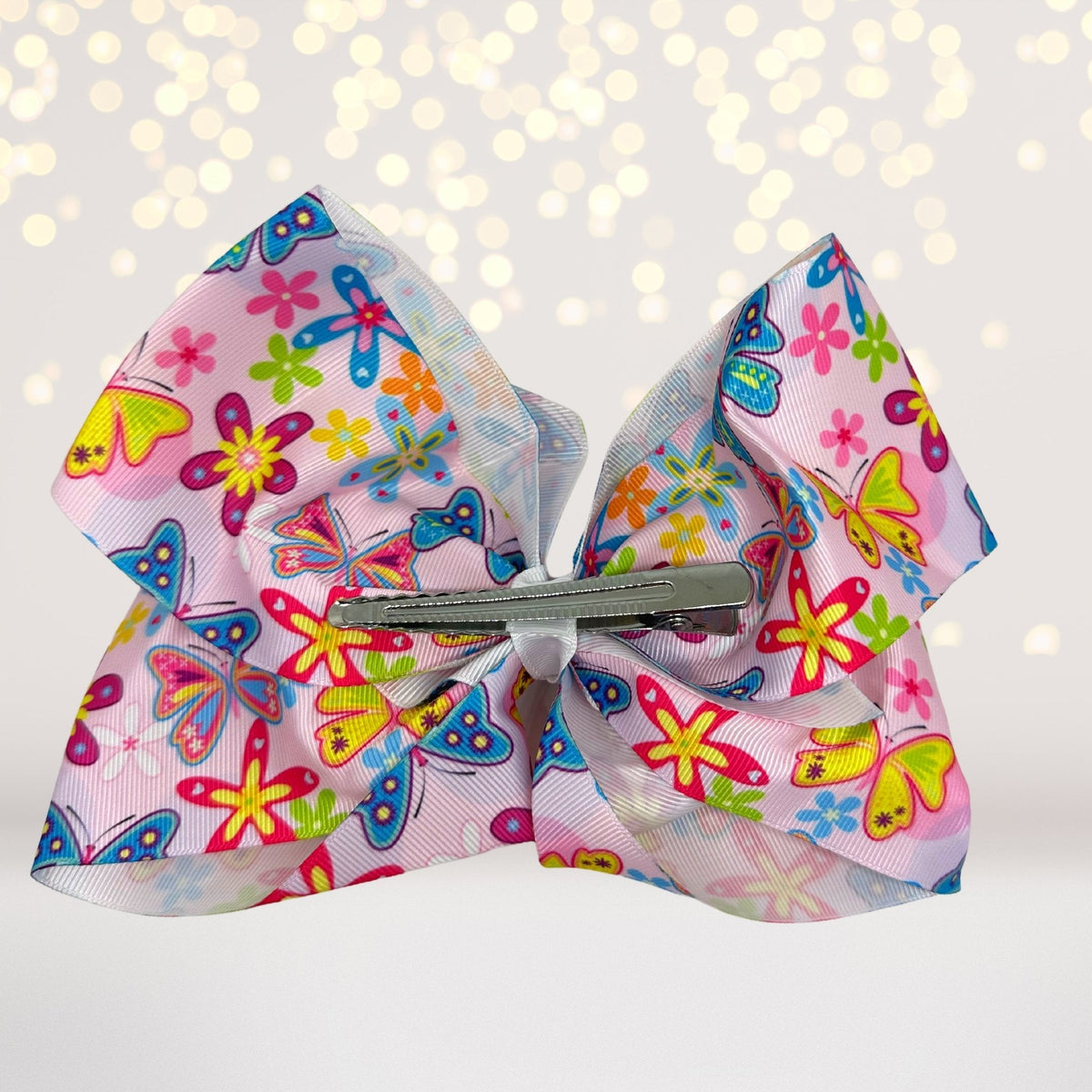 Butterfly large hair bow and oversized barrette in pastel pink with butterfly print on Tampa Home & Garden Store