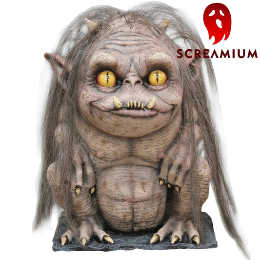 Ragar Gremlin Prop Halloween decor by SCREAMIUM with yellow eyes and shaggy fur on base on Tampa Home & Garden Store