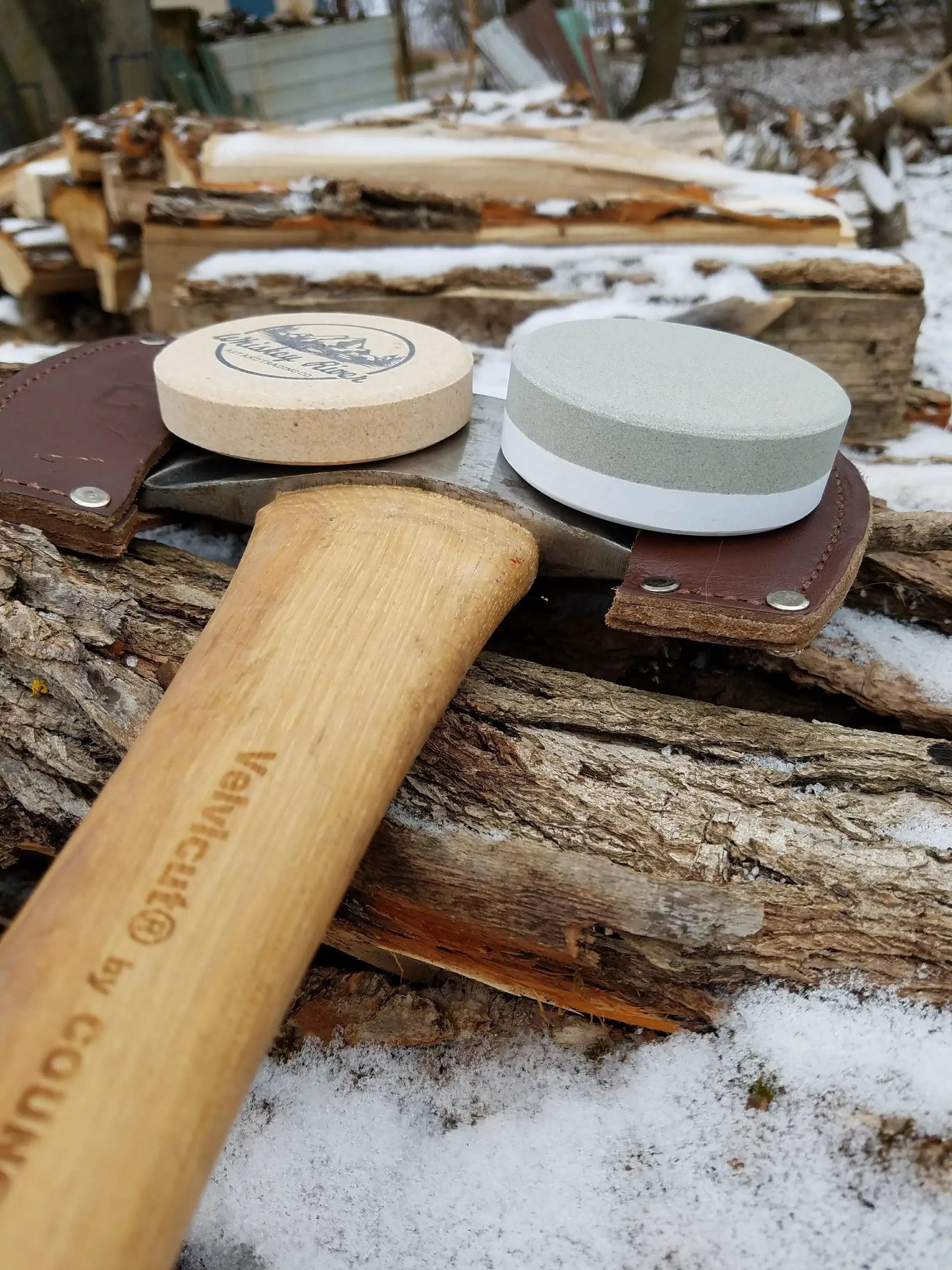 Whiskey River American Pioneer Sharpening Puck set of two: beige logo puck and gray two-layer puck on Tampa Home & Garden Store