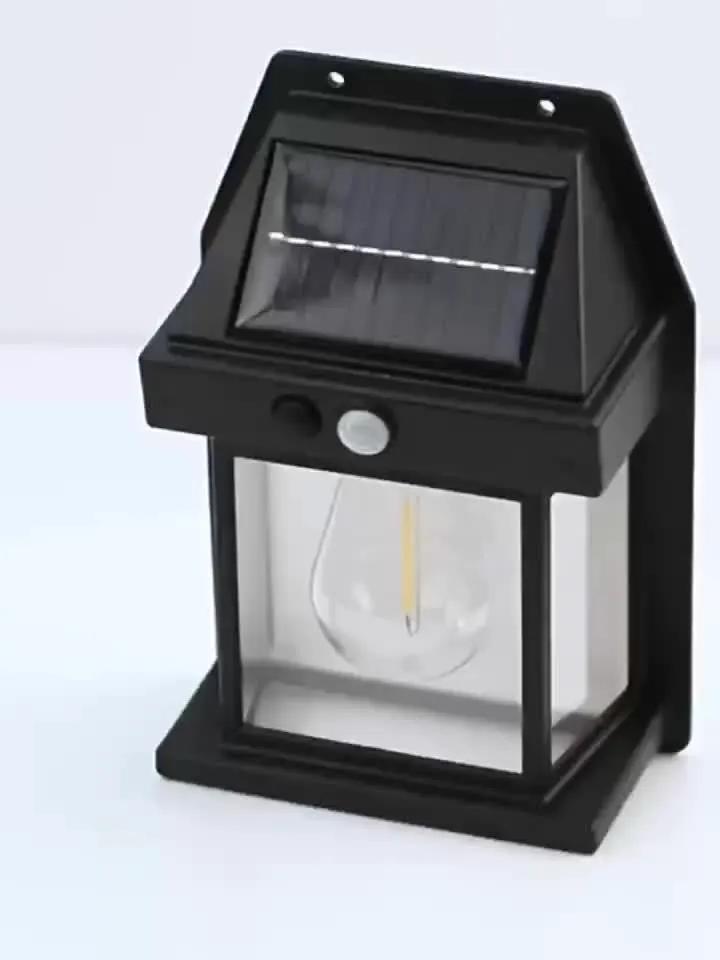 Solar Motion Sensor Wall Light in black metal with glass lantern and solar panel on Tampa Home & Garden Store