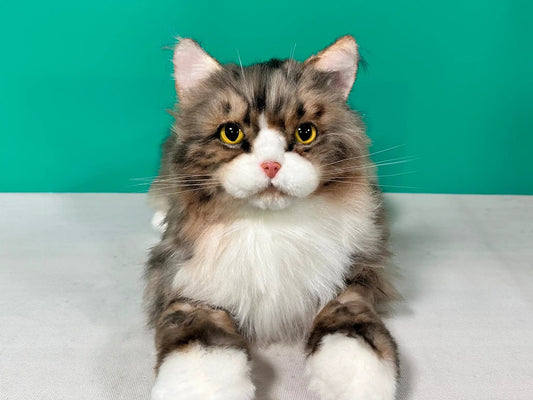 Plush Norwegian Forest Cat life-sized companion with brown tabby fur and yellow eyes on Tampa Home & Garden Store