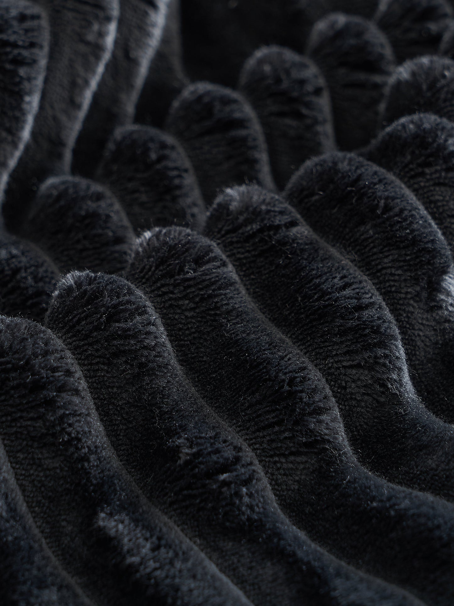 Sectional sofa close-up in black plush velvet fabric by HouseOfZazla on Tampa Home & Garden Store