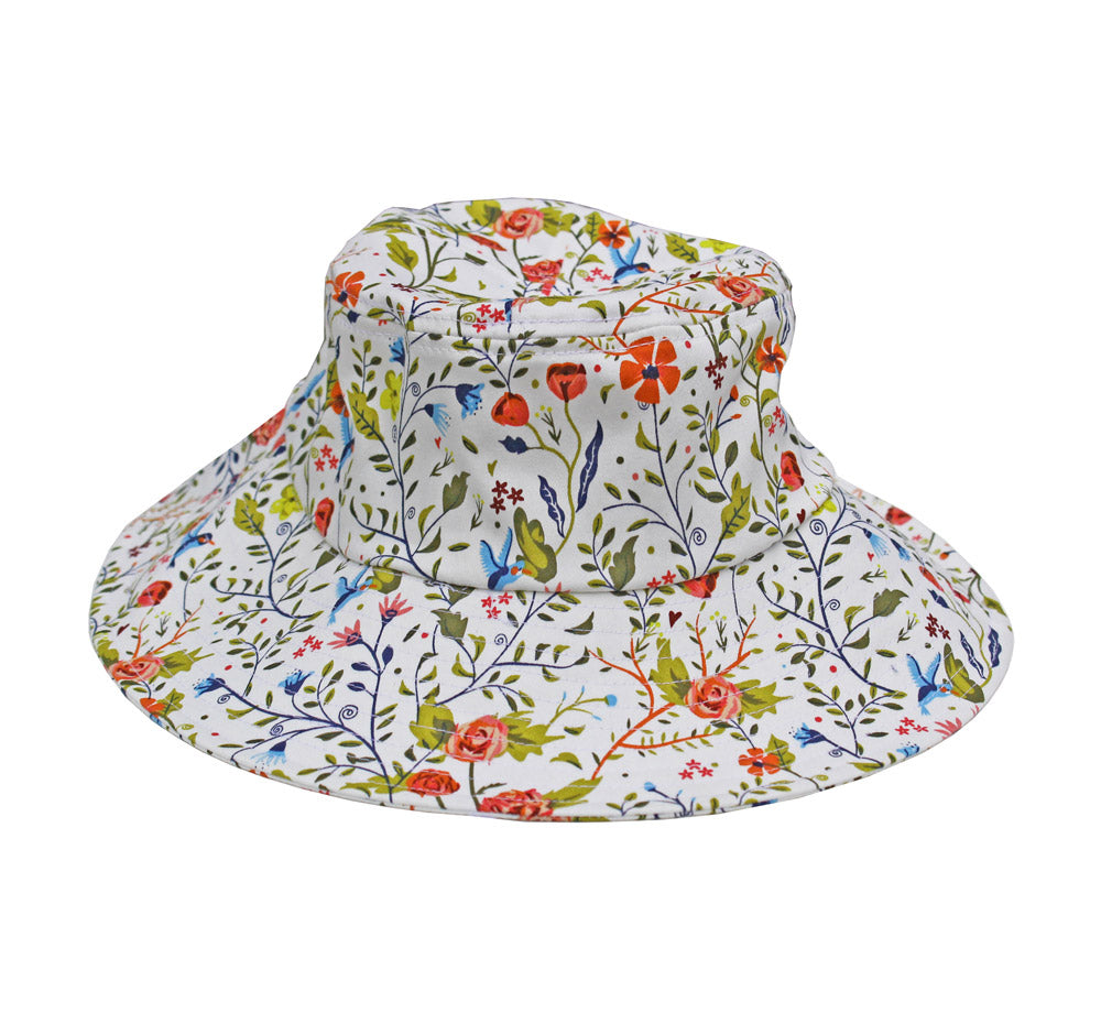 Cotton bucket sun hat in Garden of Paradise floral print, white background, Womanswork on Tampa Home & Garden Store