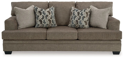 Stonemeade stationary sofa in taupe textured fabric with 2 geometric-pattern pillows on Tampa Home & Garden Store