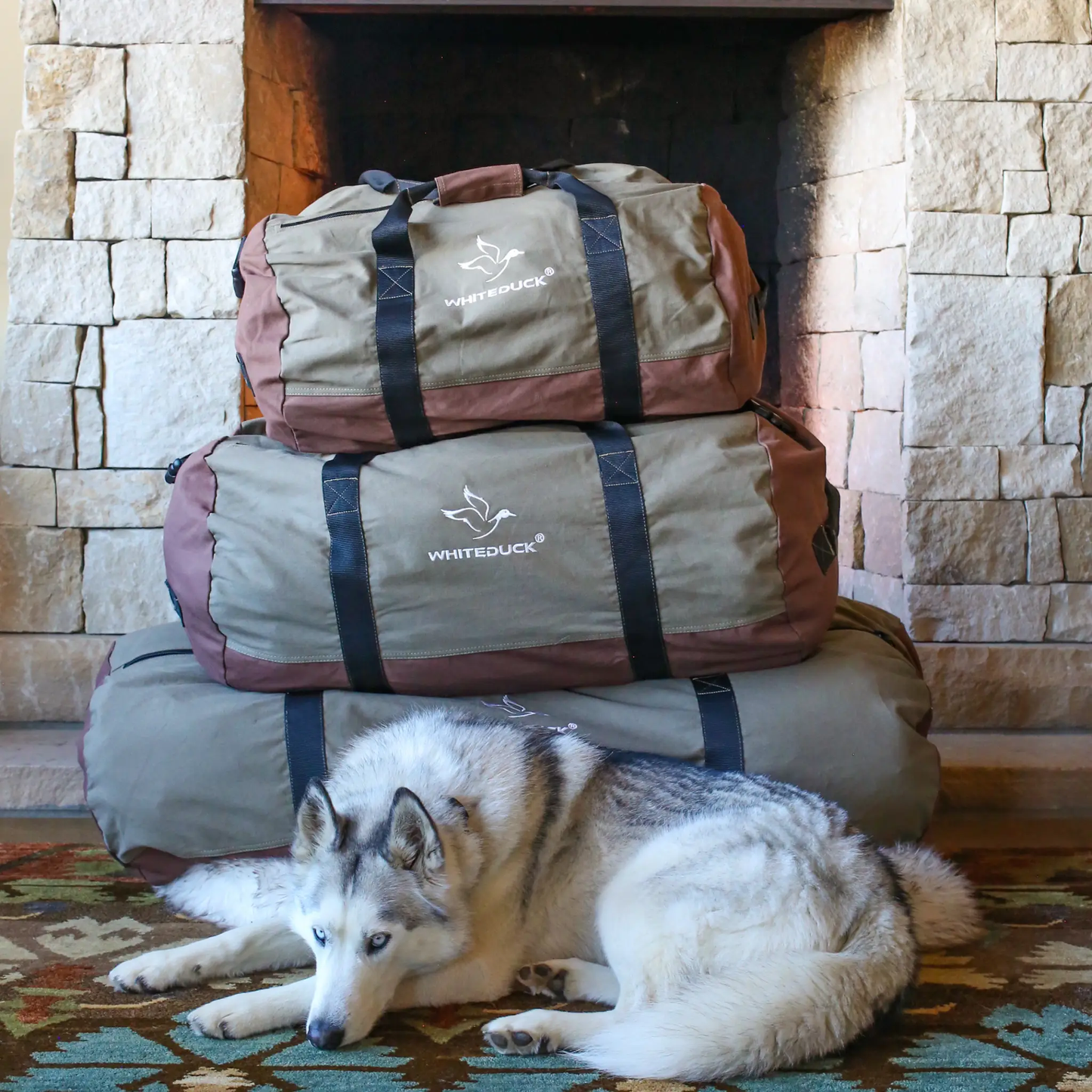 Filios Canvas Duffel Bag by White Duck Outdoors, gray canvas with black straps on Tampa Home & Garden Store