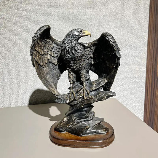 Bronze-tone eagle figurine with outstretched wings on a rocky base for wine cabinet decor on Tampa Home & Garden Store