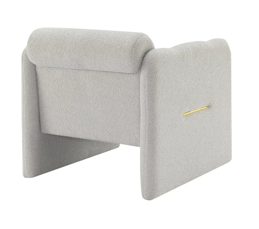 Pair of light grey armchairs with waved arms in boucle fabric gold badge detail on Tampa Home & Garden Store