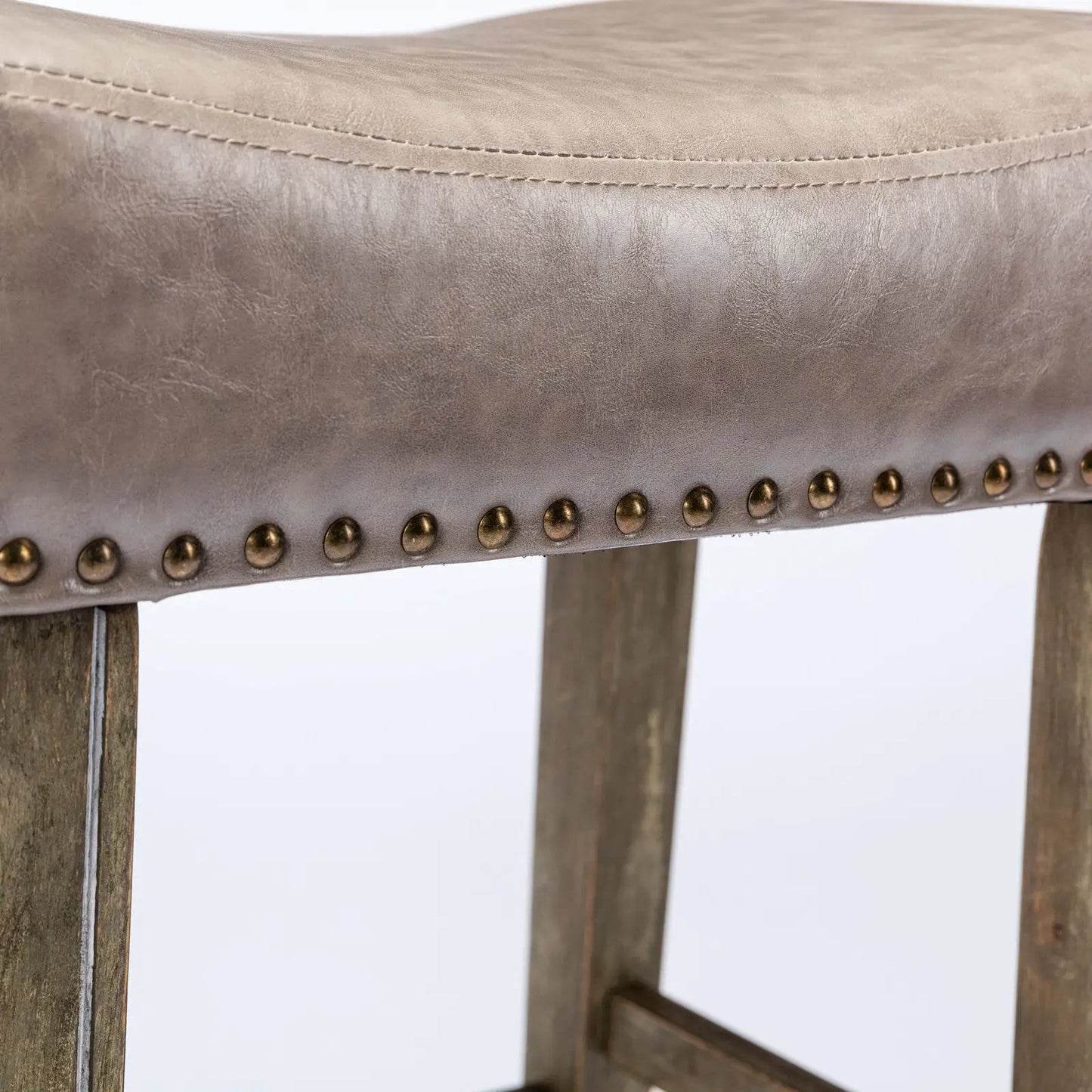 Counter height backless bar stool in brown leather with nailhead trim and wooden legs on Tampa Home & Garden Store