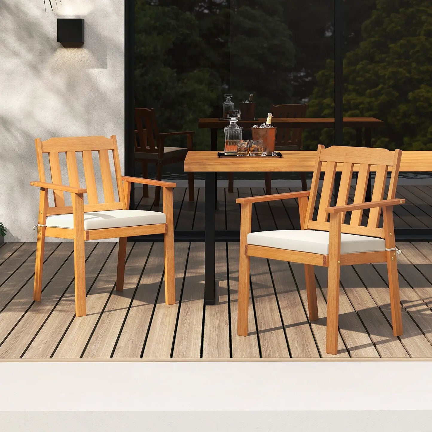 Patio dining chairs set acacia wood with white cushions, two chairs beside table on wood deck on Tampa Home & Garden Store