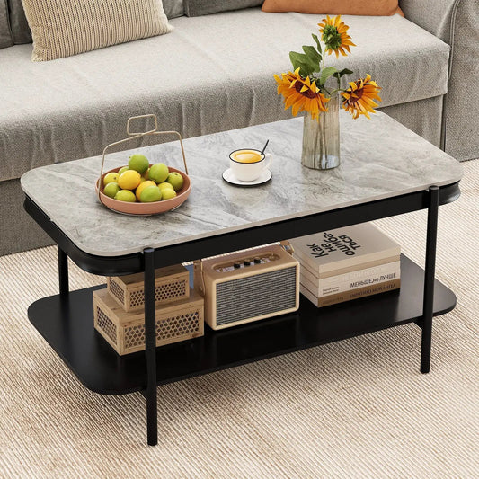 Two-tier coffee table with sintered stone top and black metal frame in a cozy living room on Tampa Home & Garden Store