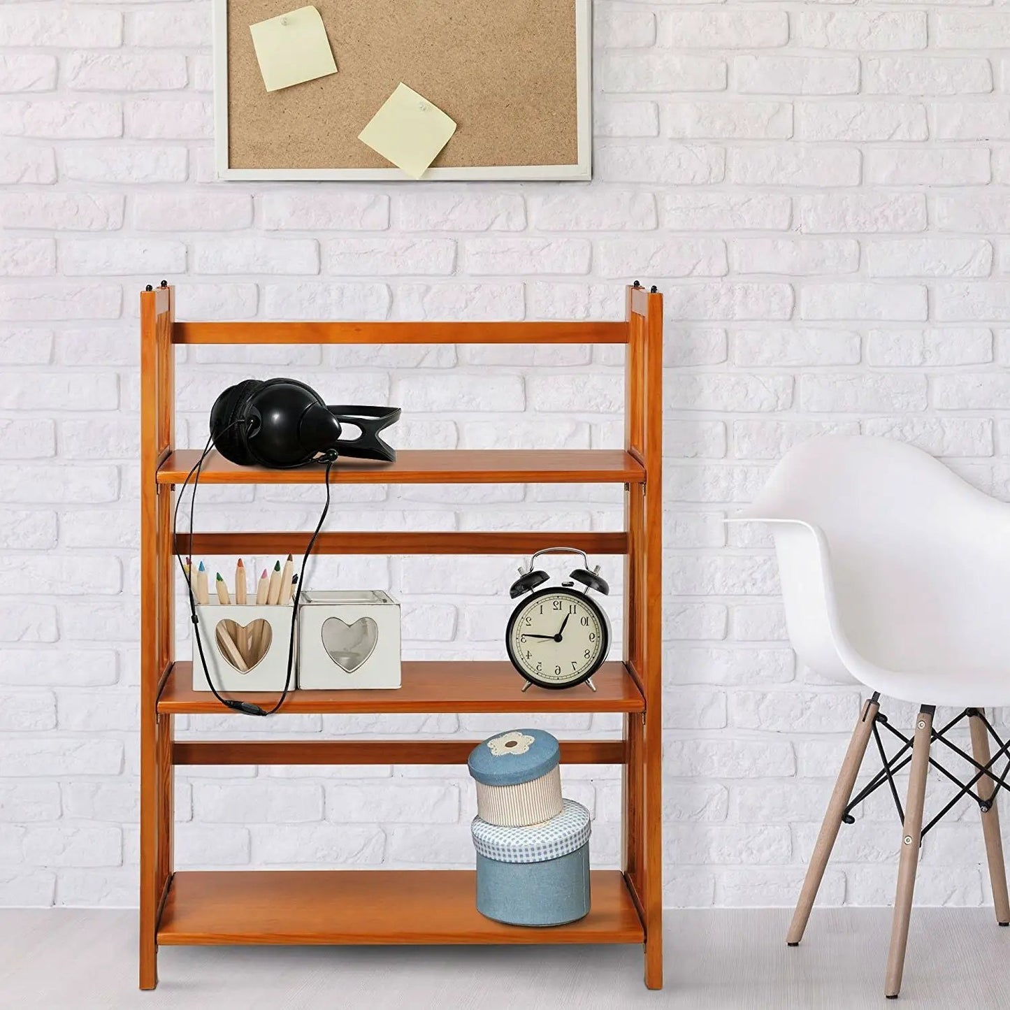 3-Shelf Folding Bookcase in honey oak finish with headphones and clock decor on Tampa Home & Garden Store