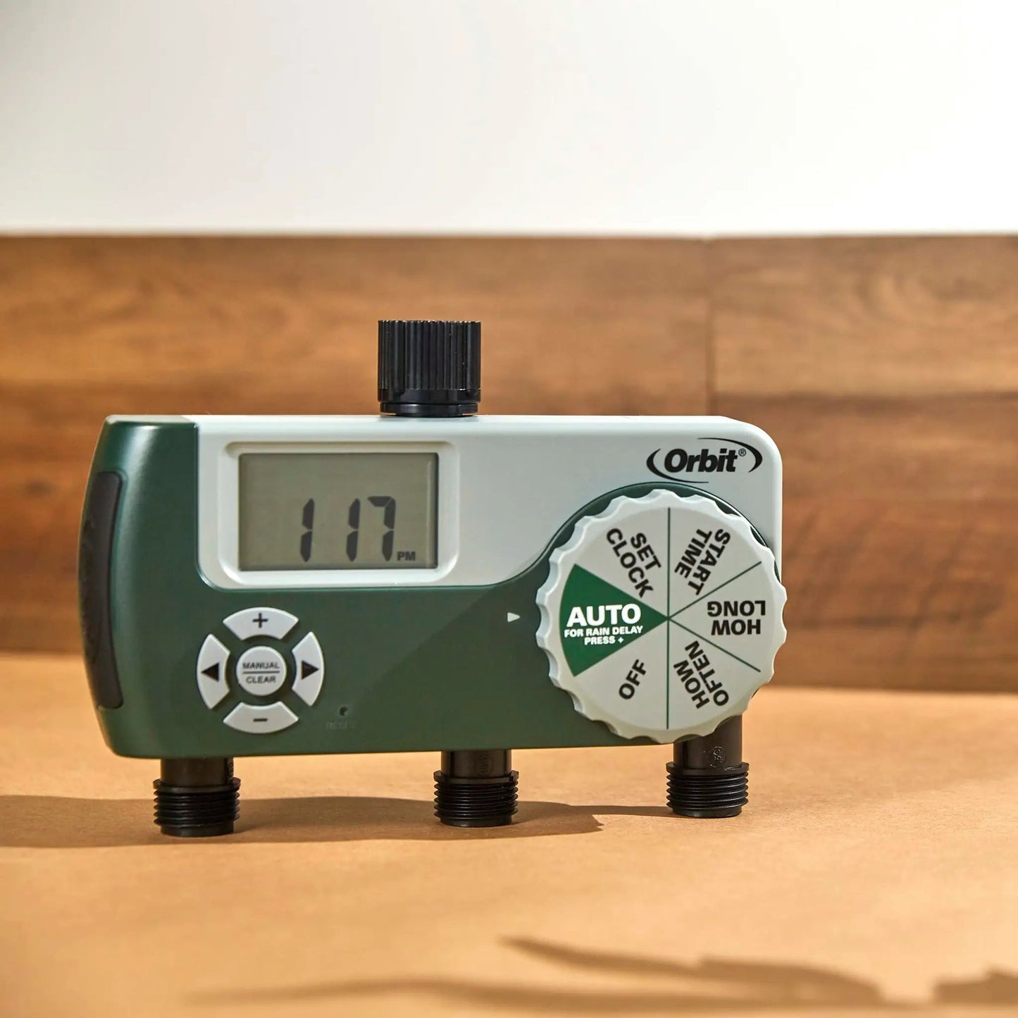 Three-outlet hose timer with digital display by Orbit Irrigation, green and white unit on Tampa Home & Garden Store