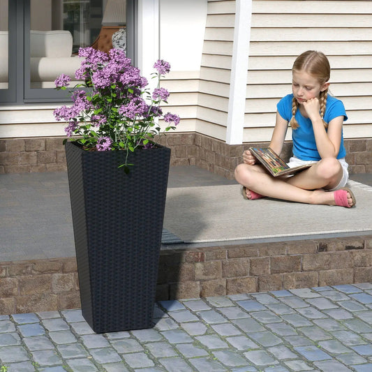 Set of 2 30-inch tall open-base flower pots in black wicker with purple blooms on a patio on Tampa Home & Garden Store
