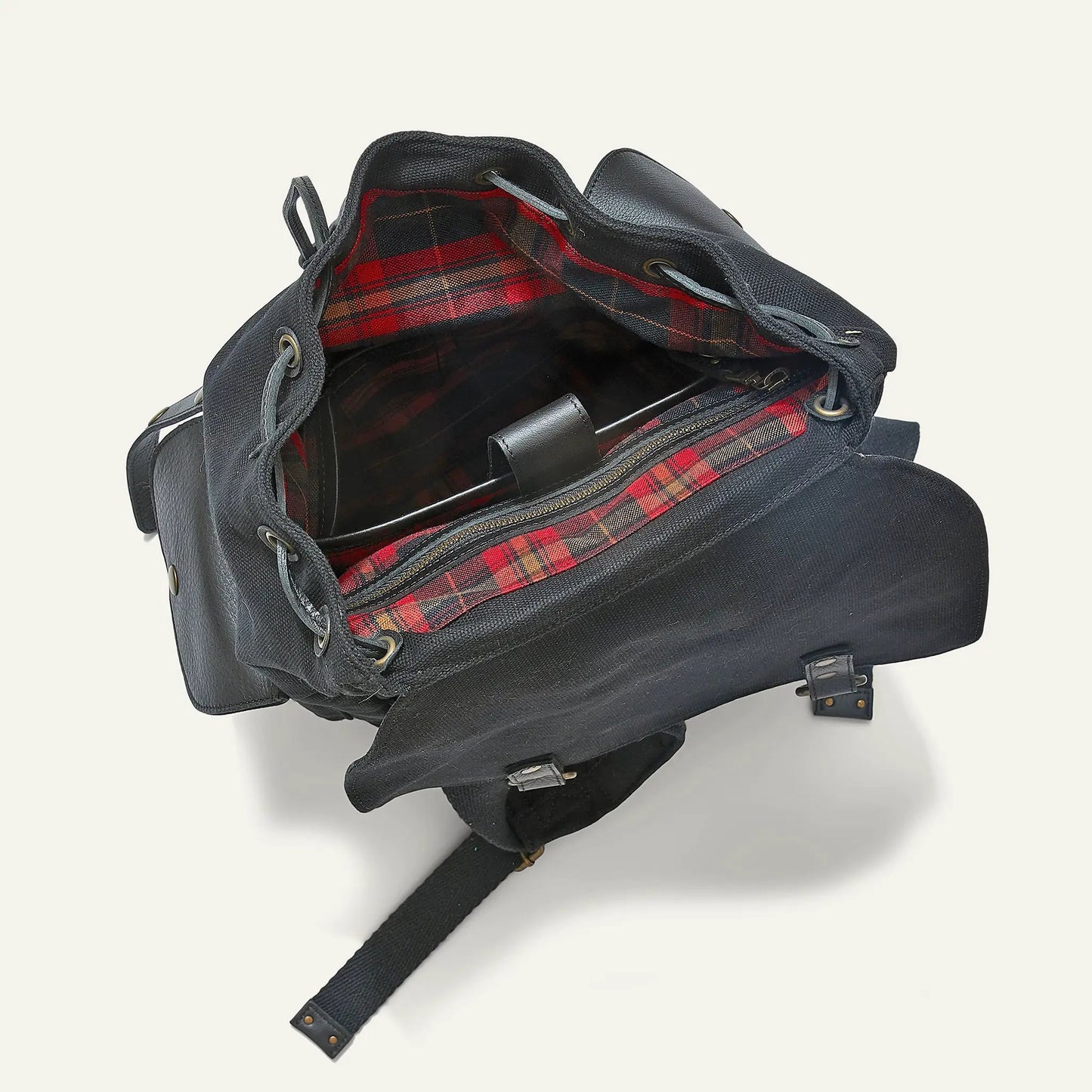 Lennon Canvas and Leather Backpack by Will Leather Goods; dark navy exterior, red plaid lining on Tampa Home & Garden Store