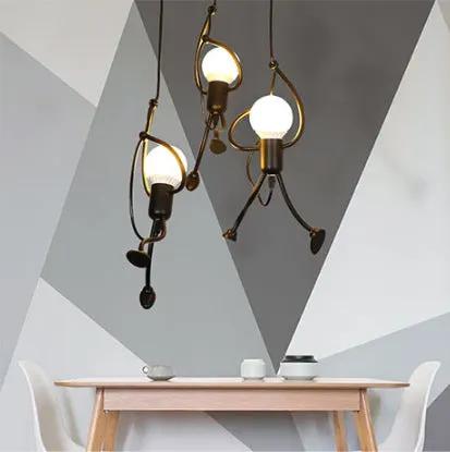 Decorbites Indoor Villain Chandelier in Black Iron, three globe bulbs over a wooden table on Tampa Home & Garden Store