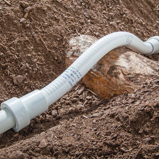 Three Quarter Inch PVC-Lock Repair Coupling by Orbit Irrigation, white PVC-Lock on dirt on Tampa Home & Garden Store