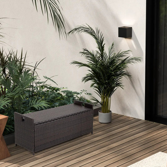 34 Gallon Patio Storage Bench in dark brown wicker on a wooden deck with potted plants on Tampa Home & Garden Store