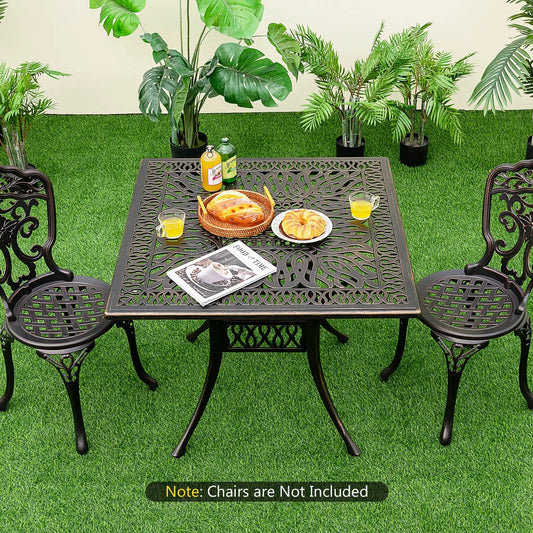 Bronze aluminum patio square table with umbrella hole and four ornate chairs on grass on Tampa Home & Garden Store