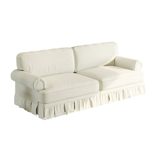 Luxuriously comfortable cloud sofa with cream upholstery, rolled arms, and pleated skirt on Tampa Home & Garden Store