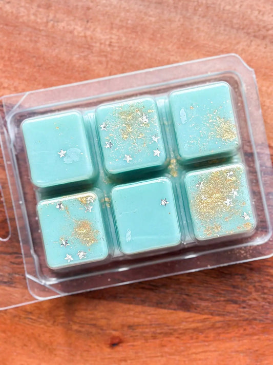 Reading Nook Wax Melt Soft Floral Musk teal cubes with gold glitter and stars, 9-pack on Tampa Home & Garden Store