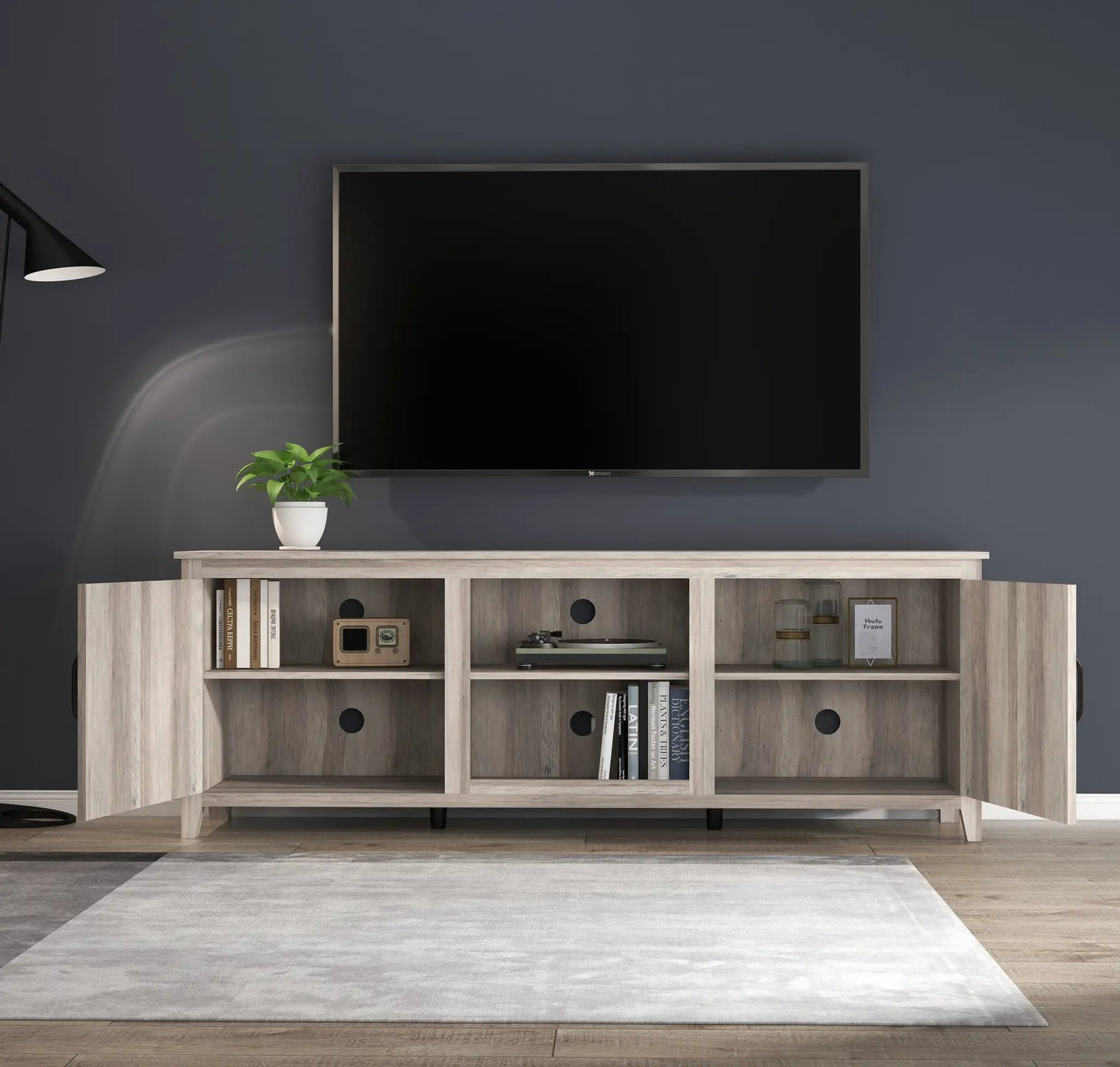 Television stand entertainment center grey walnut with open cubbies and a mounted TV on top on Tampa Home & Garden Store
