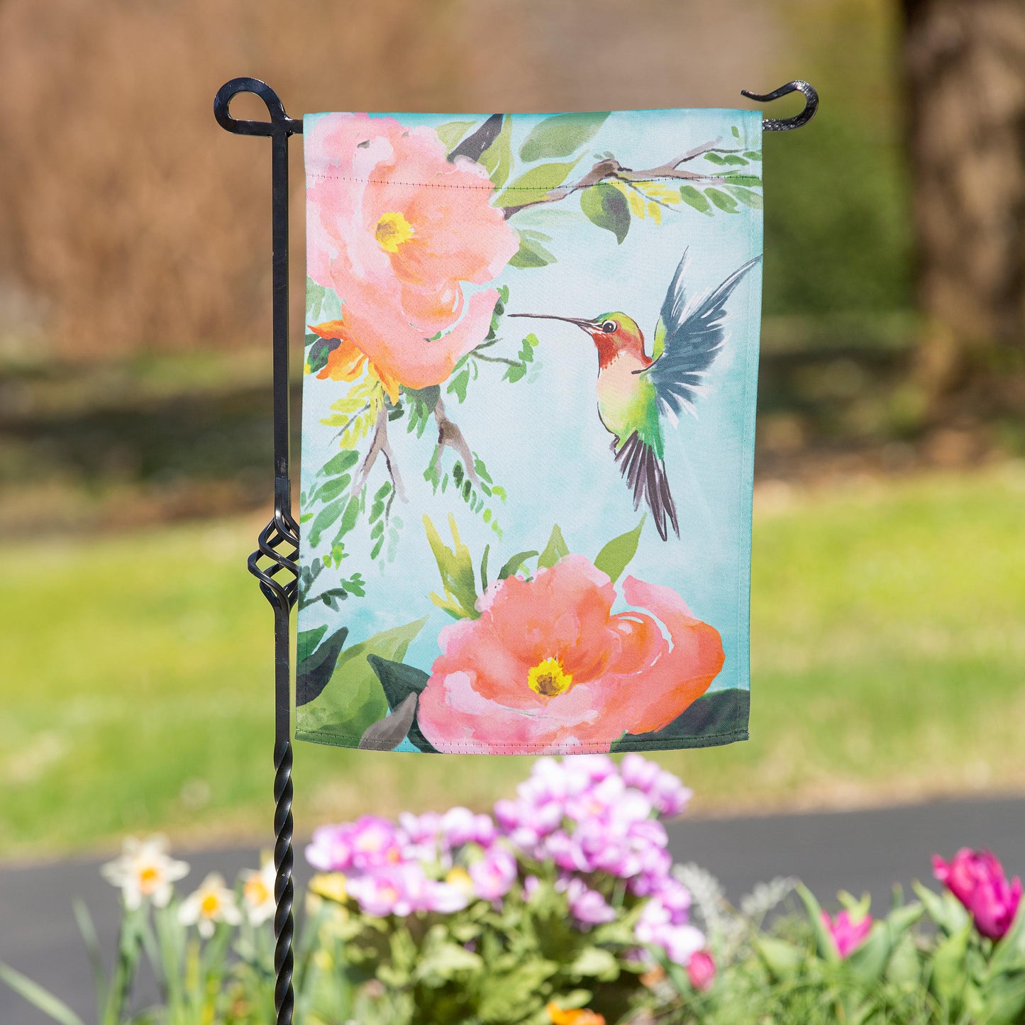 Hummingbird suede garden flag turquoise background with pink blooms and green leaves on Tampa Home & Garden Store