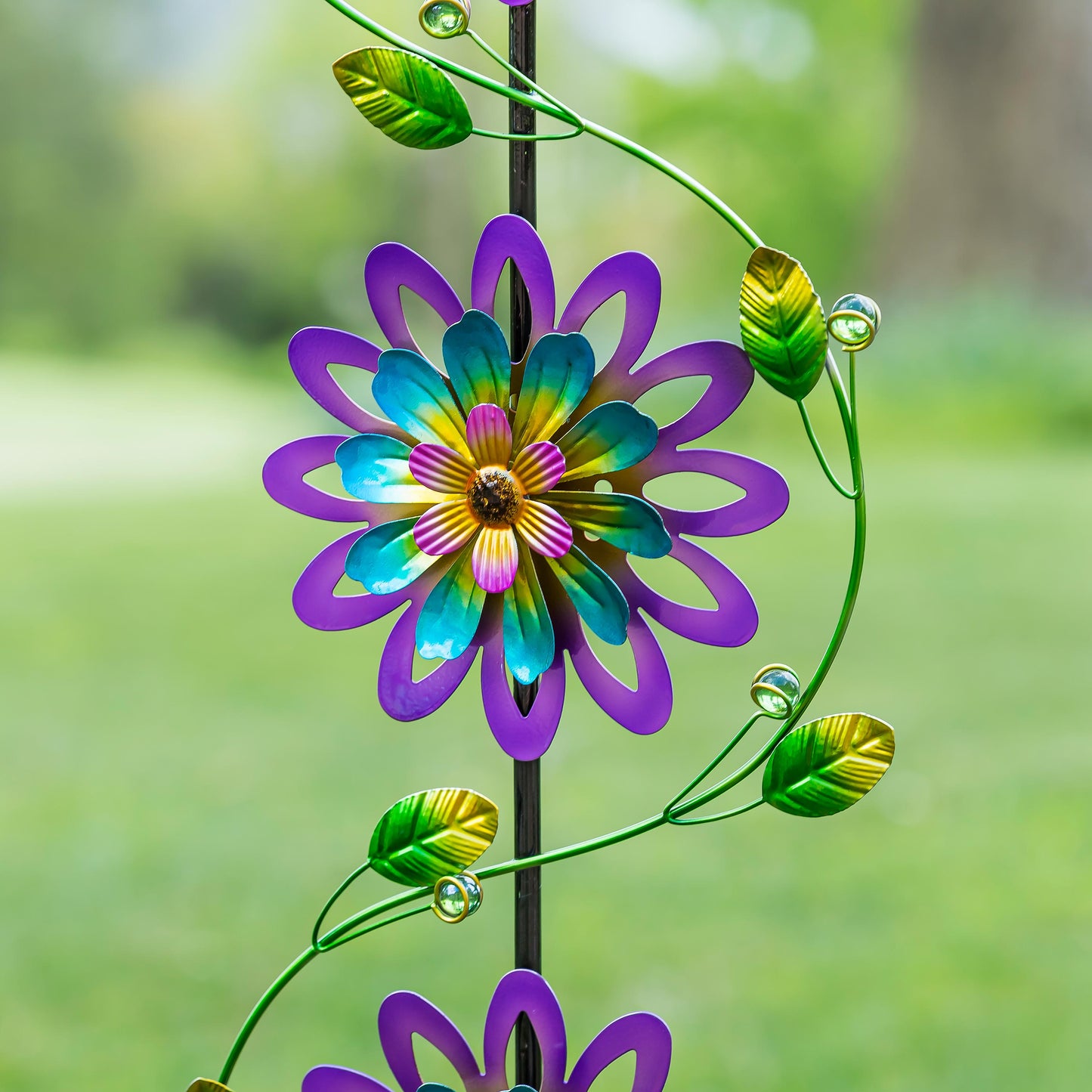 Garden Stake with Spinning Flowers Violet Trio wind spinner 71-inch tall on Tampa Home & Garden Store