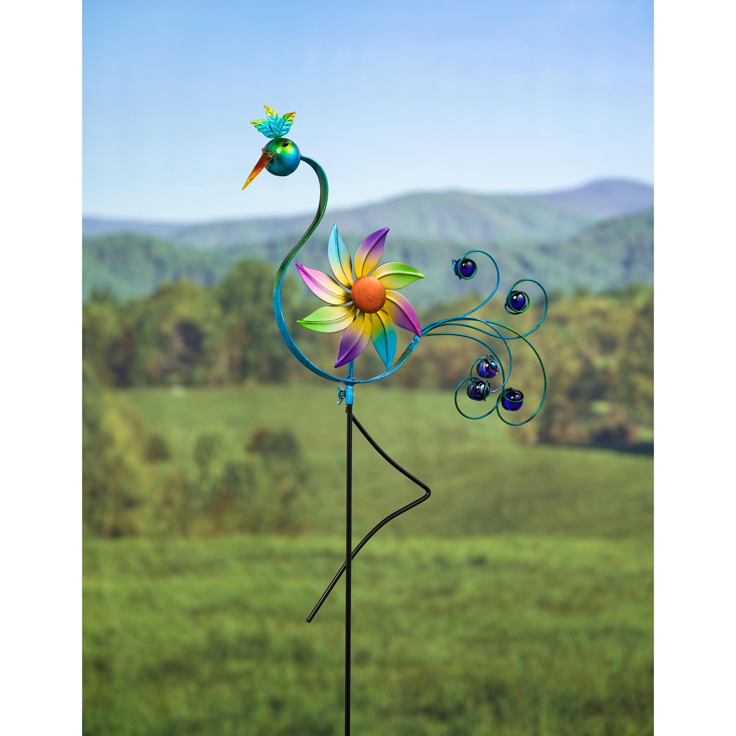 Colorful windspinner garden stake with a green/yellow/pink bird on a stem and rainbow petals on Tampa Home & Garden Store