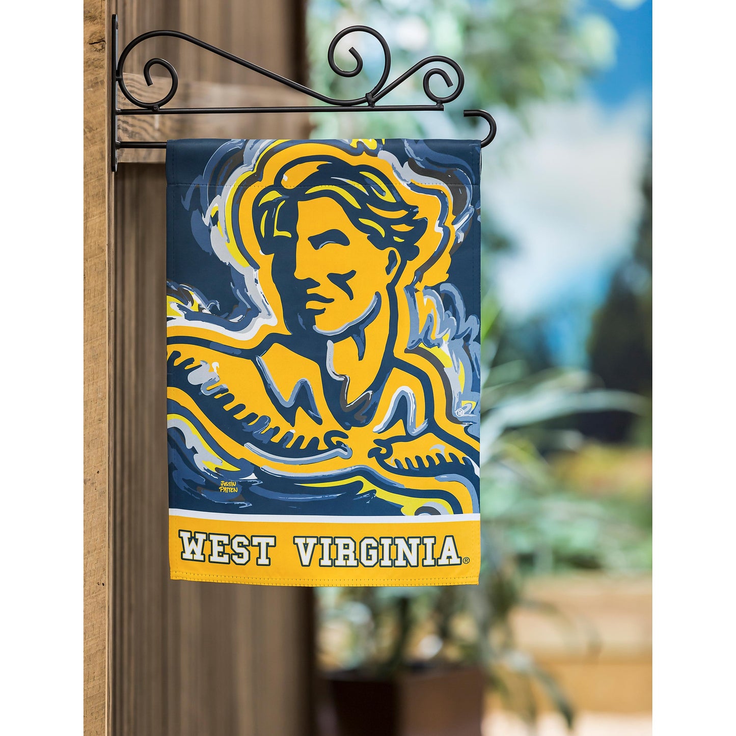 West Virginia suede flag with WVU logo in yellow on navy hangs from bracket by Evergreen on Tampa Home & Garden Store