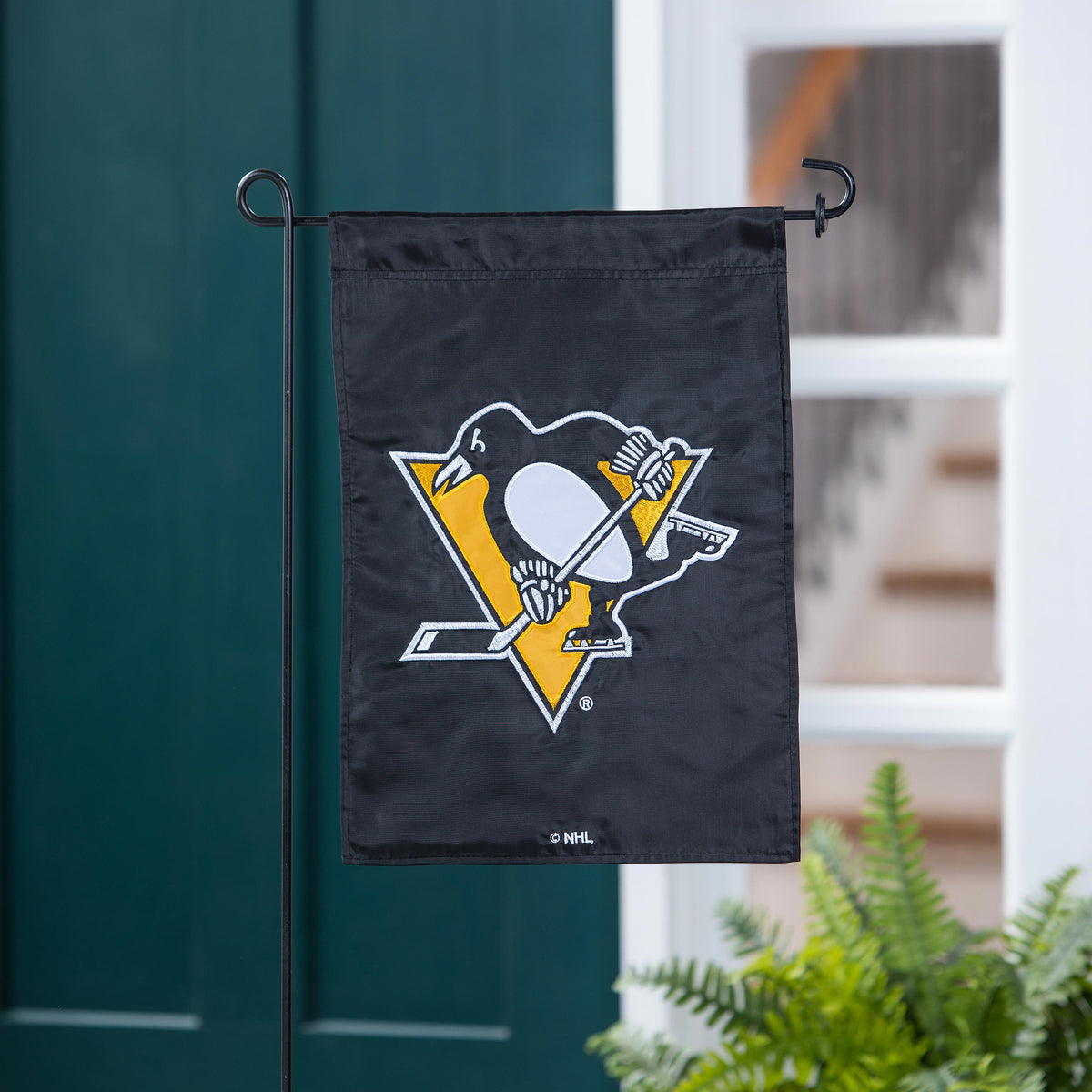 Pittsburgh Penguins applique garden flag black fabric with NHL emblem on a metal stand on Tampa Home & Garden Store