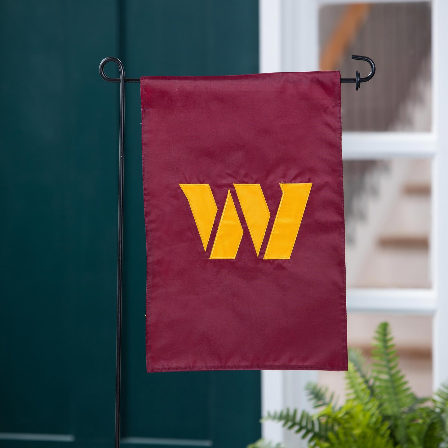 Applique Flag Washington Commanders burgundy with yellow W emblem on black metal stand on Tampa Home & Garden Store