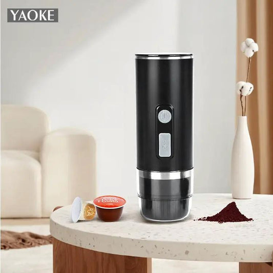 Yaoke portable espresso capsule coffee machine, black with silver trim, 2 capsules nearby on Tampa Home & Garden Store