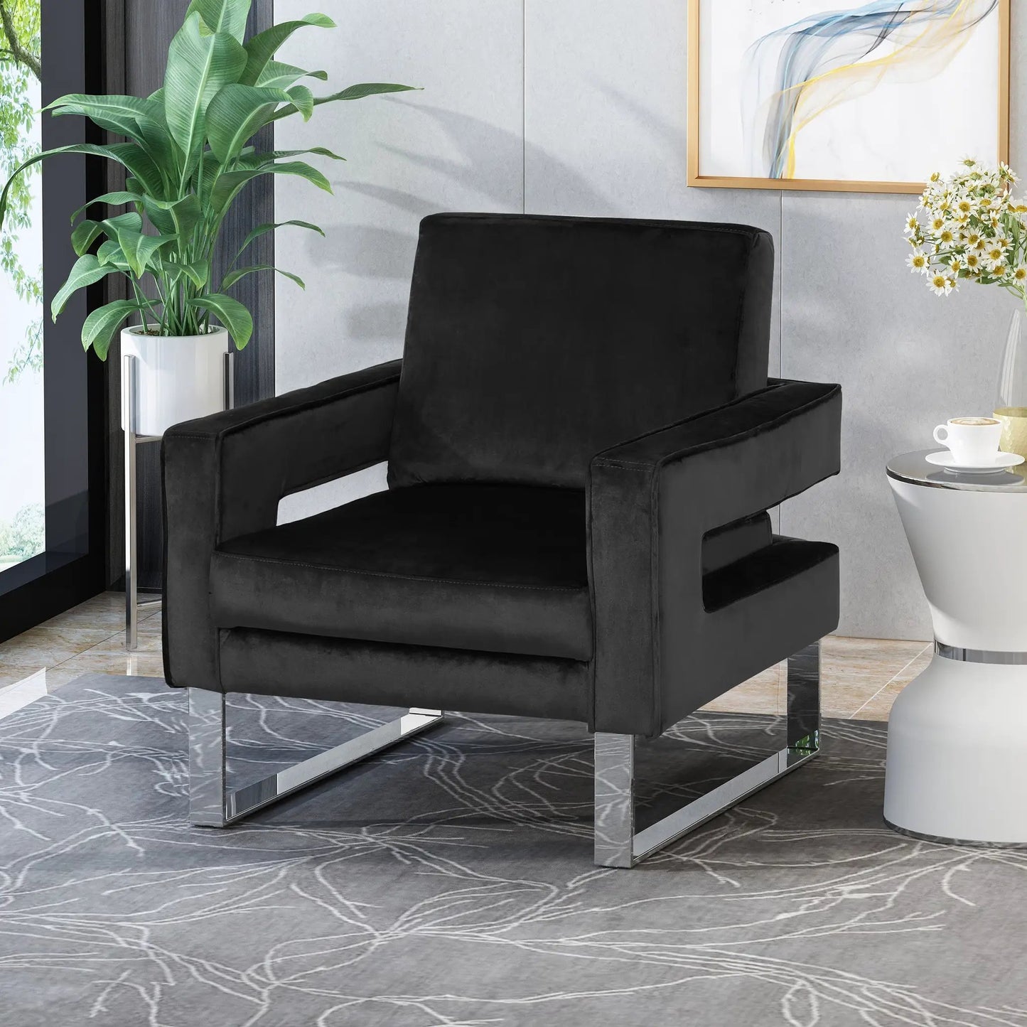 Velvet Arm Chair Black in modern living room with green plant and gold-framed abstract art on Tampa Home & Garden Store