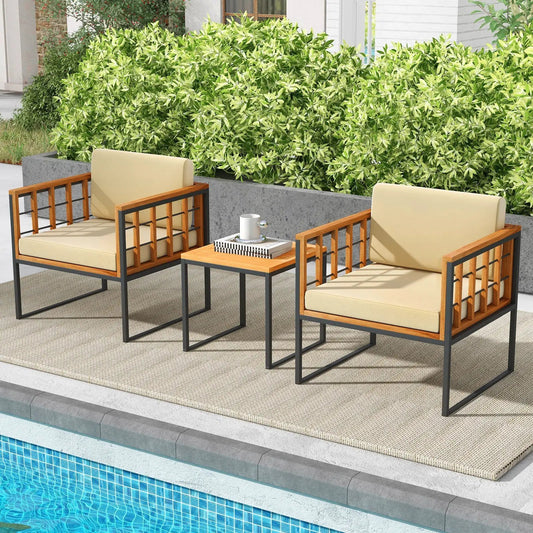Three-piece acacia wood patio chair set with beige cushions and black metal frames poolside on Tampa Home & Garden Store