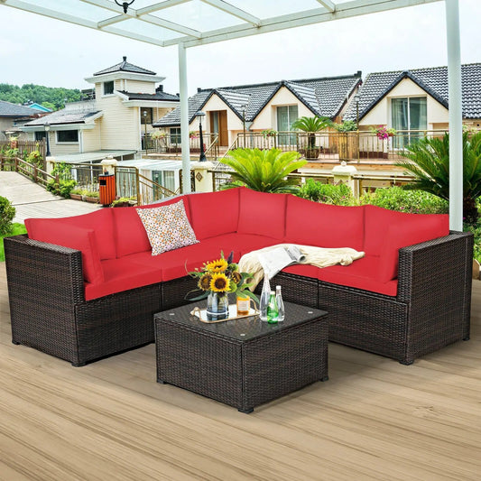 Six-piece outdoor patio sofa set with red cushions in wicker, glass coffee table on a deck on Tampa Home & Garden Store