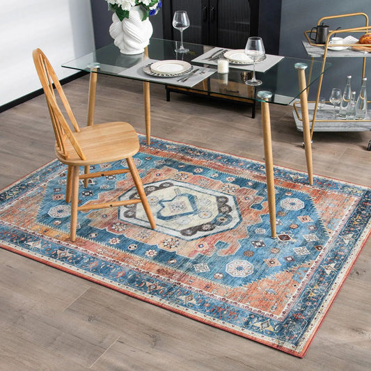 Vintage Indoor Area Rug 5x7 blue and coral pattern under glass dining table on Tampa Home & Garden Store