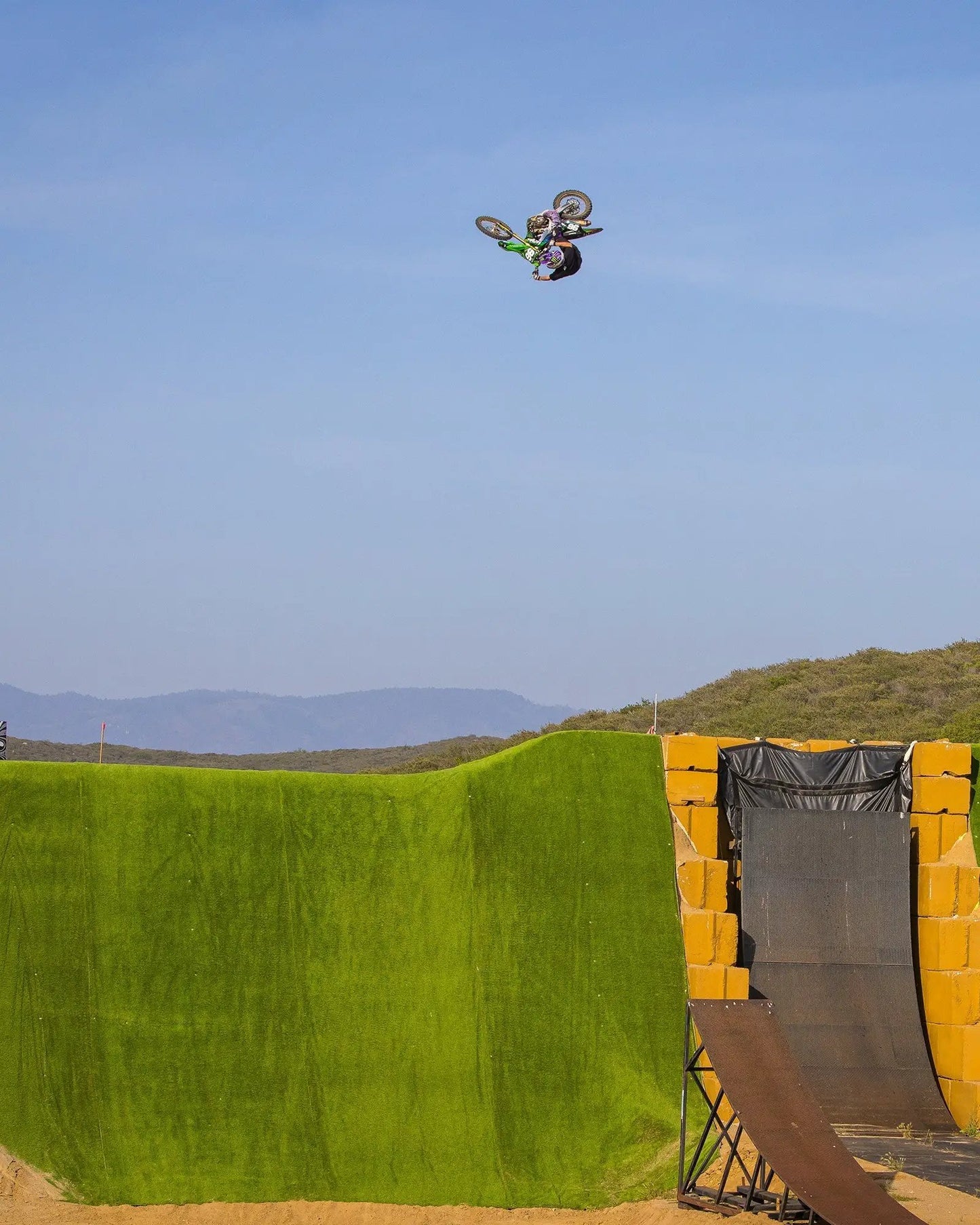 Slayco96 knee guard EVS Sports motocross protective gear in midair freestyle jump on Tampa Home & Garden Store
