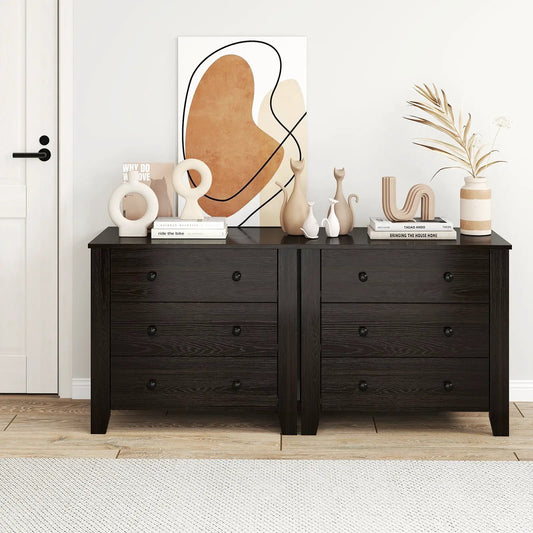 Dark brown 3-drawer wide dresser pair with black knobs, styled with artwork and decor on top on Tampa Home & Garden Store