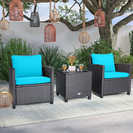 Two-seat outdoor wicker patio set with turquoise cushions and glass table under lanterns on Tampa Home & Garden Store