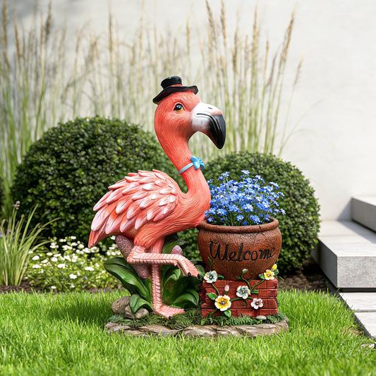 Pink flamingo garden sculpture with flower pot planter and blue blooms on Tampa Home & Garden Store