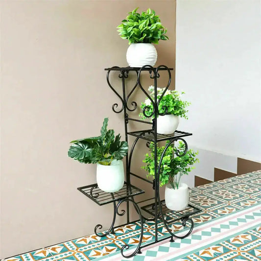 Ornate Black 4-Tier Metal Plant Stand with white pots and greenery living room Decorbites on Tampa Home & Garden Store
