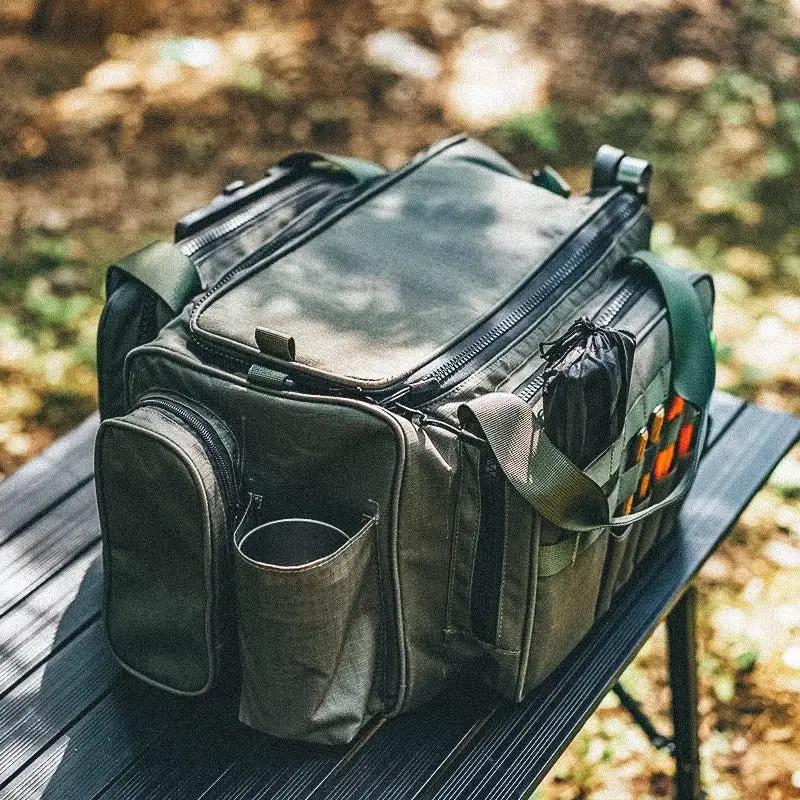 Outdoor camping picnic bag in olive-green with multiple zip pockets and a shoulder strap on Tampa Home & Garden Store