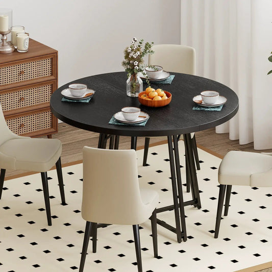 Round dining table for 4–6 with cross base, black top, 4 beige chairs on Tampa Home & Garden Store