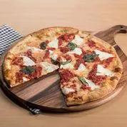 Kalmar Home round acacia wood cutting and charcuterie board on Tampa Home & Garden Store