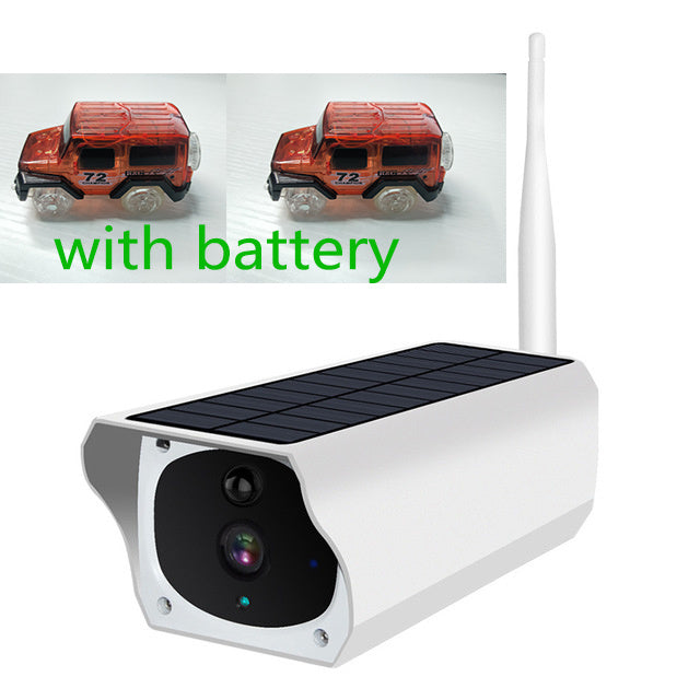 Solar surveillance camera Sell My Stuff, white housing; two red toy cars on Tampa Home & Garden Store